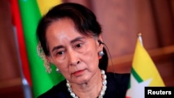 Aung San Su Ći (na fotografiji) je osuđena na ukupno 33 godine zatvora u nizu politički obojenih suđenja