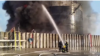 Pompierii au stins rezervoarele de petrol după o lovitură cu dronă în orașul Azov, regiunea Rostov, Rusia, 18 iunie 2024.