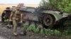 Lugansk: ceremonie funerară pentru 58 de membri ai milițiilor separatiste pro-ruse, uciși în războiul din Ucraina, 12 iulie 2022. 