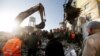 Albania -- Emergency personnel work near a damaged building in Thumane November 26, 2019