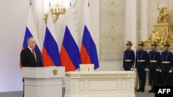 Ruski predsednik Vladimir Putin drži govor na ceremniji na kojoj je formalizovan neutemeljen pokušaj Moskve da anektira još četiri delimično okupirana ukrajinska regiona, Moskva, 30. septembar 2022.