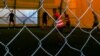 Disa të rinj duke luajtur futboll në një sallë sportive të Qendrës Korrektuese për të Mitur në Lipjan.