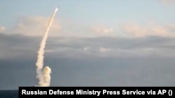 A Russian warship launches a cruise missile at a target in Ukraine.