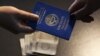 Kyrgyzstan - passport, bribe, corruption, money, generic, undated