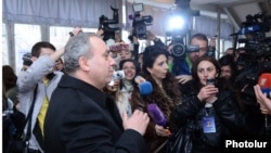 Armenia - Opposition presidential candidate Hrant Bagratian votes talks to reporters at a polling station in Yerevan, 18Feb2013.