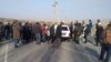 The conflict on the Kyrgyz-Tajik border. The next day. Standing people on the border. Batken, Kyrgyzstan.