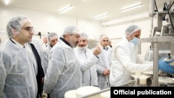 Armenia - Prime Minister Nikol Pashinian (second from left) visits a new cheese factory in Yerevan, March 26, 2019.