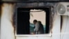 NORTH MACEDONIA -- A forensic officer works at the site after a fire at a makeshift hospital, in North Macedonia's northwestern city of Tetovo, September 9, 2021