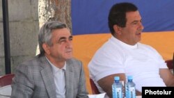 Armenia - President Serzh Sarkisian (L) and businessman Gagik Tsarukian watch a sporting competition in Tsaghkadzor, 14Jul2012.