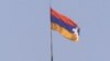 Nagorno-Karabakh -- The unrecognized republic's flag flies over the presidential building in Stepanakert, 18Jun2000