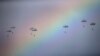 Serbia -- Russian paratroopers jump past rainbow from an IL-76 transport plane during a joint Serbian-Russian military training exercise "Slavic Brotherhood" in the town of Kovin, near Belgrade, November 7, 2016