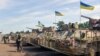 Бронетранспортери в штаб-квартирі українських військ під Ізюмом, 16 липня 2014 року