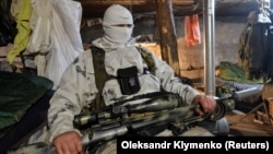  A Ukrainian serviceman rests at the front.
