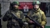 Украинские военнослужащие позируют для фото в укрытии Донецкой области, 21 февраля 2023 года
