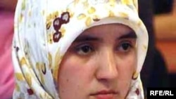 A young woman wears a hijab in Tajikistan.
