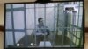 Українка Надія Савченко під час засідання суду на відеозв'язку із СІЗО. Москва, 25 лютого 2015 року