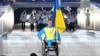 Михайло Ткаченко на знак протесту проти військової агресії Росії у Криму один за всю команду України взяв участь в церемонії відкриття Паралімпійських ігор, Сочі, 7 березня 2014 року 