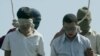 Mahmud Asgari, 16, (right) and Ayaz Marhoni, 18, were convicted of raping a young boy and executed i