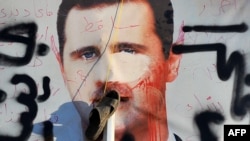Poster sa likom sirijskog predsjednika Bashara al Assada