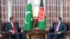 Afghan Foreign Minister Salahuddin Rabbani (R) met his Pakistani counterpart Shah Mehmood Qureshi in Kabul on December 24.