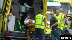 An injured person is loaded into an ambulance following the shootings in Christchurch, New Zealand on March 15.