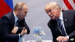Владимир Путин и Дональд Трамп во время первого президентства Трампа