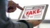 GENERIC – Fake news concept man reading news media technology on smartphone just Fake
