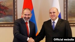 Kazakhstan -- Armenian PM Nikol Pashinian (L) and Russian PM Mikhail Mishustin. 31Jan., 2020
