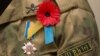 Generic – A remembrance poppy and Ukrainian soldier