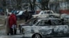 Знищені внаслідок обстрілу бойовиками «ДНР» автомобілі у Маріуполі. 25 січня 2015 року