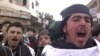 Участники акции протеста против режима президента Сирии Башар аль-Ассада в Кафранбеле, 19 февраля 2012 года. 