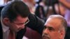 Armenia -- Armen Martirosian of the Heritage Party (L) talks to its top leader, Raffi Hovannisian, during a party congress, 10Jul2010.