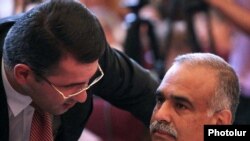 Armenia -- Armen Martirosian of the Heritage Party (L) talks to its top leader, Raffi Hovannisian, during a party congress, 10Jul2010.