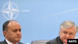 Armenia -- Defense Minister Seyran Ohanian (L) and Foreign Minister Edward Nalbandian (C) at an annual meeting with NATO's North Atlantic Council in Brussels, 12 May 2010.