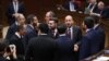 Armenia - Deputies from the ruling Civil Contract party talk on the parliament floor, Yerevan, April 15, 2025.