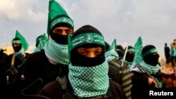 ستیزه‌جویان گروه افراطی حماس هنگام تبادل اجساد شماری از گروگان‌های اسرائیلی، ۲ اسفند ۱۴۰۳
