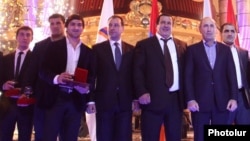 Armenia - Former President Robert Kocharian (second from right) and Prosperous Armenia Party leader Gagik Tsarukian at an awards ceremony organized for prominent Armenian athletes near Yerevan, 26Dec2013.