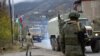 Azerbaijani military trucks are moving along the Lachin corridor near Nagorno-Karabakh in the presence of Russian peacekeepers deployed there as part of the Moscow-brokered 2020 ceasefire agreement between Azerbaijan and Armenia (file photo).