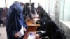Afghan women cast their vote during the parliamentary elections in Kandahar in October 2018.