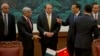 Chinese Premier Li Keqiang (3rd R) gestures near Pakistan Prime Minister Nawaz Sharif (C) and Punjab Chief Minister Shahbaz Sharif (2nd L) before a signing ceremony at the Great Hall of the People in Beijing in 2013. 