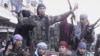 Члены Свободной сирийской армии во время антирежимной демонстрации. Провинция Идлиб, 15 января 2012 года. 