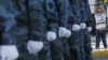 Девушка смотрит парад в непризнанной Приднестровской Молдавской Республики. Сентябрь 2012 года