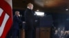 In this pool photograph distributed by the Russian state agency Sputnik, US President Donald Trump (R) and Russian President Vladimir Putin hold a joint press conference following a US-Russia summit on Ukraine at Joint Base Elmendorf-Richardson in Anchora