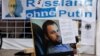 Плакат с портретом Зелимана Хангошвили на акции протеста против бездействия российского правительства, Германия, 2019 год