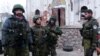 Боевик группировки «ДНР» Михаил Толстых («Гиви») крайний справа. Оккупированный Донецк, 13 ноября 2014 года