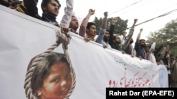 People shout slogans as they protest the release of Asia Bibi, a Christian accused of blasphemy, whose death sentence was annulled by the Supreme Court in Lahore in November 2018.