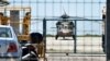A Turkish military helicopter lands in the northern Greek city of Alexandroupolis with eight men on board who have requested political asylum after the attempted coup in Turkey, July 16, 2016. 