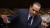 Italijanski premijer Silvio Berluskoni (levo) govori u parlamenta u toku sednice o poverenju vladi, Rim, 13. decembar 2010.
