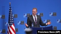 Acting U.S. Defence Secretary Patrick Shanahan talks to journalists during a press conference at the second day of a NATO defense ministers meeting at NATO headquarters in Brussels on February 14.