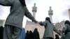 Afghanistan -- Policewomen form a human chain to protect women demonstrators during a protest against a controversial new law for Shi'ite Muslim women, Kabul, 15Apr2009